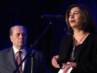 Renette Sasouni, president of the Reach Canada board, on stage with honourary chair and retired chief justice John D. Richard, at the cabaret fundraiser held on Wednesday, May 20, 2015, at the St. Elias Centre.
