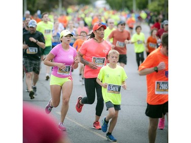 Runners get close to the finish line during the 5K race at Tamarack Ottawa Race Weekend Saturday May 23, 2015.