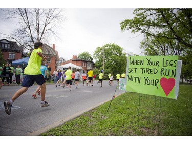 Runners get close to the finish line during the 5K race at Tamarack Ottawa Race Weekend Saturday May 23, 2015.