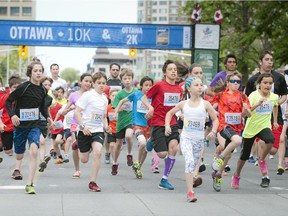 Runners of all ages hit the pavement as they start the 2K race at Tamarack Ottawa Race Weekend Saturday May 23, 2015.