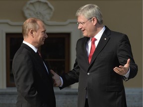 Russias President Vladimir Putin welcomes Canadas Prime Minister Stephen Harper at the start of the G20 summit on September 5, 2013 in Saint Petersburg. Russia hosts the G20 summit hoping to push forward an agenda to stimulate growth but with world leaders distracted by divisions on the prospect of US-led military action in Syria.
