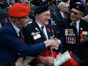 Canadian Second World War veterans share stories prior to the start of commemorative ceremony at Holten Canadian War Cemetery in Holten, Netherlands, on Monday, May 4, 2015, on the eve of the 70th anniversary of the Liberation of the Netherlands.