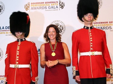 Singer-songwriter Sarah McLachlan, flanked by a pair of foot guards, at the Governor General's Performing Arts Awards Gala held at the National Arts Centre on Saturday, May 30, 2015.