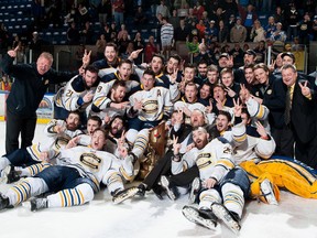 The Carleton Place Canadians celebrate their second straight Fred Page Cup championship on Sunday in Cornwall. The Canadians are the first team to win back-to-back Fred Page Cup titles.