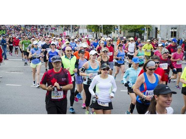 The crowd of runners kick off the first part of the marathon at Tamarack Ottawa Race Weekend, Sunday, May 24, 2015.