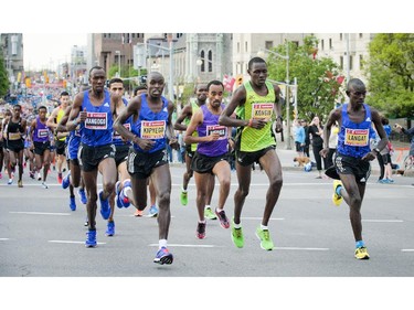 The crowd of runners, led by the elite athletes, kick off the first part of the marathon at Tamarack Ottawa Race Weekend, Sunday, May 24, 2015.