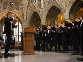 The Estonian National Male Choir sings inside the rotunda at the entrance to Parliament Hill on May 22, 2015.