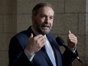 NDP leader Tom Mulcair speaks with reporters following party caucus on Parliament Hill Wednesday May 6, 2015 in Ottawa.