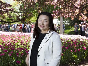 Tina Liu NCC landscape architect poses for a photo new the Dow's Lake portion of Tulip Festival in Ottawa, May 17, 2015. (Chris Roussakis/ Ottawa Citizen)