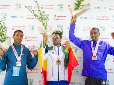 Top males to finish the marathon. L-R: Chele Dechasa, Girmay Birhanu and Philip Kangogo at Tamarack Ottawa Race Weekend, Sunday, May 24, 2015.