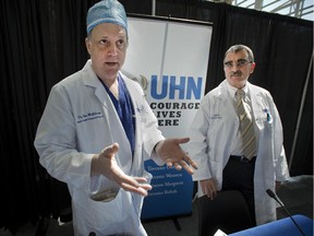 Dr. Ian McGilvray, left, and Dr. Eberhard Renner update reporters at Toronto General Hospital on the condition of liver transplant recipient Eugene Melnyk, Thursday May 21, 2015.