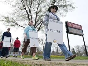 Striking teachers in Peel Region walk the picket line Tuesday. Secondary-school teachers at Ottawa's English public school boards are starting a work-to-rule campaign Thursday, joining their elementary-level colleagues who've been at it for two weeks.