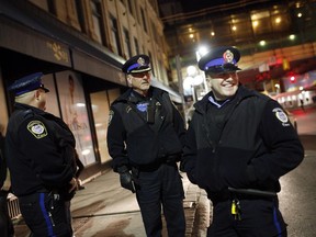 Transit police walk the beat up and down Rideau Street on a recent Friday evening.