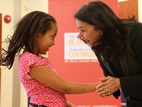 Photo from 2015: United Way campaign co-chair Yaprak Baltacıoğlu shakes the hand of eight-year old Jemma, one of more than 9,000 children who benefit from United Way-funded programs.