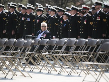 Veteran John Frank takes a seat before the start of a ceremony honouring the National Battle of the Atlantic took place at the National War Memorial in Ottawa, May 3, 2015.