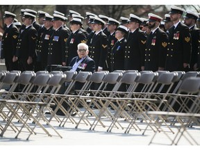 Veteran John Frank takes a seat before the start of a ceremony honouring the National Battle of the Atlantic took place at the National War Memorial in Ottawa, May 3, 2015.     (Chris Roussakis/ Ottawa Citizen)