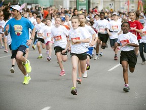 Youngsters hit the course full speed at the start line of the Kids Marathon during Ottawa Race Weekend Sunday May 25, 2014.