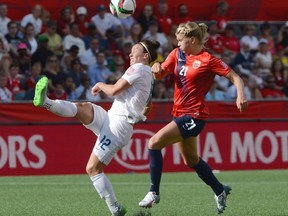 England’s Lucy Bronze (12) kicks the ball away from Norway’s Ada Hegerberg