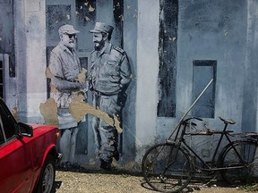 A mural of author Ernest Hemingway and Fidel Castro shaking hands