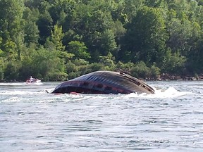 Lac Manitoba rolled over after sinking in St. Lawrence River. A second tugboat sank hours later. No one was injured on either boat.