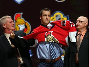 Colin White poses after being selected 21st overall by the Ottawa Senators in the first round of the 2015 NHL draft.