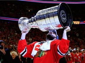 Corey Crawford kisses the Cup. Are the Blackhawks a model for success for the Ottawa Senators?