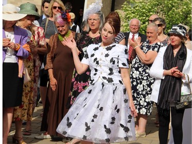 Angie Semple, Canada's representative from Parfums Christian Dior, gives a flirty wave to the crowd as she models in the Sukhoo Sukhoo fashion show presented during the annual garden party for Cornerstone Housing for Women, held at the Irish ambassador's residence on Sunday, June 7, 2015.