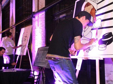 Artists participated in a live art auction to raise funds for the Snowsuit Fund at the Bash Noir party, held at Lansdowne Park's Horticulture Building on Saturday, June 20, 2015.