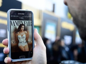 A photo editor views the July cover of Vanity Fair featuring Caitlyn Jenner on June 1, 2015 in Westwood, California.