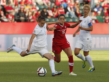 Jonelle Filigno #16 of Canada and Ria Percival #2 of New Zealand battle for the ball during the FIFA Women's World Cup Canada Group A match between Canada and New Zealand at Commonwealth Stadium on June 11, 2015 in Edmonton, Alberta, Canada.