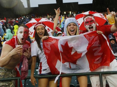 EDMONTON, AB - JUNE 11: Canadian fans cheer during a rain delay in their match against New Zealand during the FIFA Women's World Cup Canada Group A match between China and Netherlands at Commonwealth Stadium on June 11, 2015 in Edmonton, Alberta, Canada.
