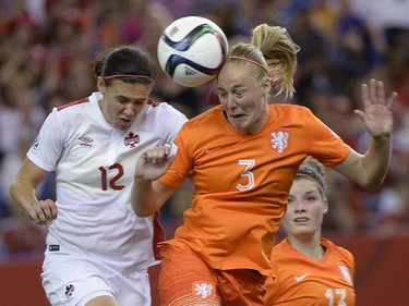 Canada's Christine Sinclair (12) and Netherlands' Stefanie Van Der Gragt (3)battle for the ball during second half FIFA Women's World Cup soccer in Montreal on Monday, June 15, 2015.