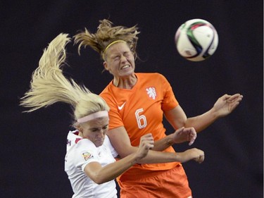 Canada's Kaylyn Kyle (6) and Netherlands' Anouk Dekker (6) battle for the ball during second half FIFA Women's World Cup soccer in Montreal on Monday, June 15, 2015.