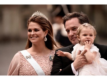 Princess Madeleine of Sweden, her husband Christopher O'Neill and their daughter Princess Leonore attend the royal wedding of Prince Carl Philip of Sweden and Sofia Hellqvist at The Royal Palace on June 13, 2015 in Stockholm, Sweden.