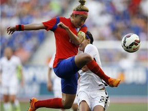 South Korea midfielder Cho Sohyun, front, deflects a pass intended for an American forward.