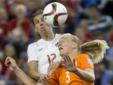 Canada forward Christine Sinclair and Netherlands defender Stefanie Van Der Gragt battle for the battle during second half Women's World Cup soccer action Monday, June 15, 2015 in Montreal.