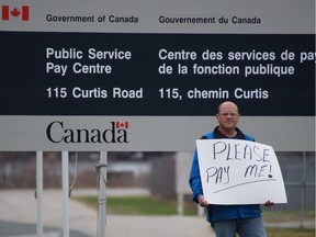 Corrections officer Stephen Robertson protesting outside the pay centre in Miramichi on May 8th, 2015.