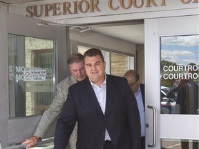 Former Conservative MP Dean Del Mastro leaves court after being granted bail in Peterborough, Ont., on Friday, June 26, 2015.