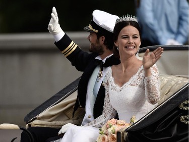 Prince Carl Philip of Sweden and his wife Princess Sofia of Sweden ride in the wedding cortege after their marriage ceremony on June 13, 2015 in Stockholm, Sweden.