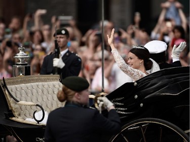 Prince Carl Philip of Sweden and his wife Princess Sofia of Sweden ride in the wedding cortege after their marriage ceremony on June 13, 2015 in Stockholm, Sweden.