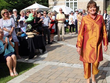 Dorothy Jackson struts her stuff on the runway during the annual Sukhoo Sukhoo fashion show presented during the annual garden party for Cornerstone Housing for Women at the official residence of the Irish ambassador, on Sunday, June 7, 2015.