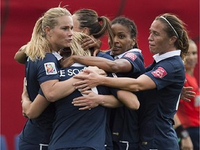 France celebrates after scoring in first half action against England.