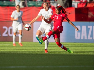 New Zealand's Hannah Wilkinson and Canada's Kadeisha Buchanan vie for the ball during their Group A match at the FIFA Women's World Cup at Commonwealth Stadium in Edmonton, Canada on June 11, 2015.