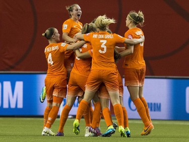 The Netherlands celebrates after scoring against Canada during their 2015 FIFA Women's World Cup Group A match at the Olympic Stadium in Montreal on June 15, 2015.
