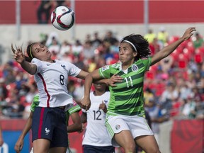 France's Jessica Houara (L) and Mexico's Monica Ocampo fight for the ball during their FIFA Women's World Cup Group F  match at Lansdowne Stadium.