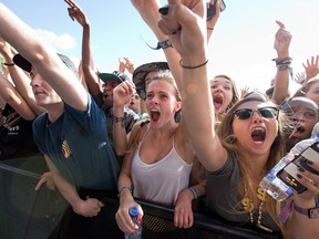 Festival fever grips fans during a performance at the RBC Ottawa Bluesfest.