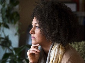 In this March 2, 2015, file photo, Rachel Dolezal, president of the Spokane chapter of the NAACP, poses for a photo in her Spokane, Wash., home.