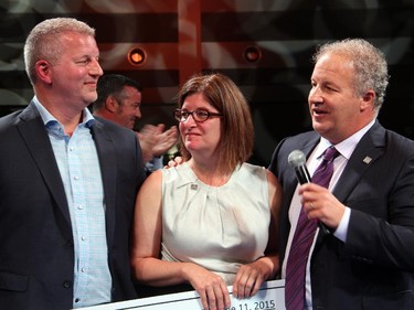 From left, Dave McGahan and Sue McGahan with their brother Mike McGahan, chief executive of CLV Group, were recognized at the annual Ringside for Youth at the Shaw Centre on Thursday, June 11, 2015, for the $1.5 million donation they and CLV made toward the Boys and Girls Club of Ottawa.