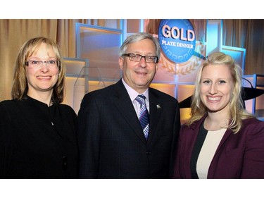 From left, EY (Ernst & Young) associate partner Angie Senyshyn, tax partner Ian Sherman and manager Leslie Ivany assisted with the popular elimination draw at the Gold Plate Dinner held at the Hellenic Meeting and Reception Centre on Tuesday, June 9, 2015.