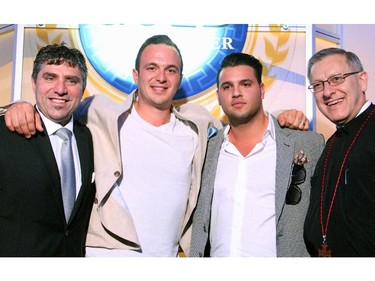From left, Hellenic Community president Nicholas Lafkas with elimination draw winners Joseph Giannetti, commercial paint manager at Preston Hardware, and Francesco Porcari, vice president of SerCo Construction Ltd., and Fr. Alex Michalopulos at the Gold Plate Dinner held at the Hellenic Meeting and Reception Centre on Tuesday, June 9, 2015.